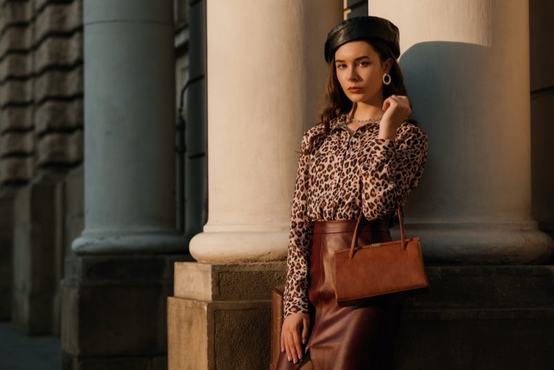 Woman Wearing Leather Beret and Leather Bag and Leather Skirt