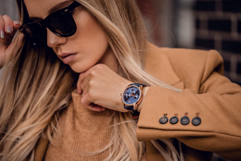 Woman Wearing Watch with Leather Wristband and Sunglasses