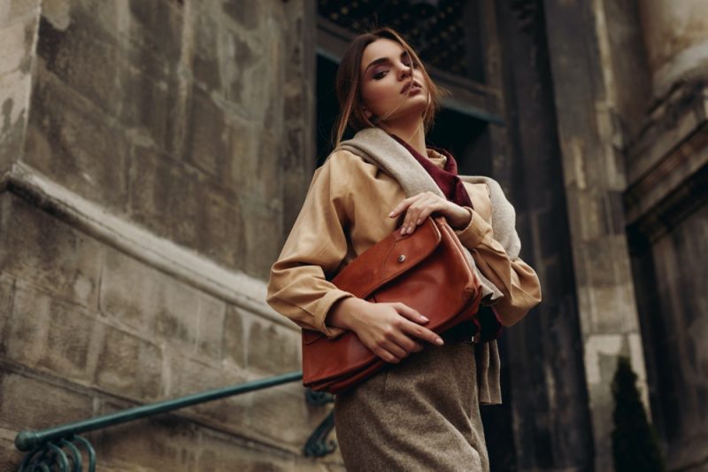 Woman with Brown Leather Bag