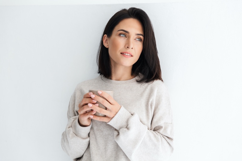 30s Woman Holding Cup Relaxed Sweater