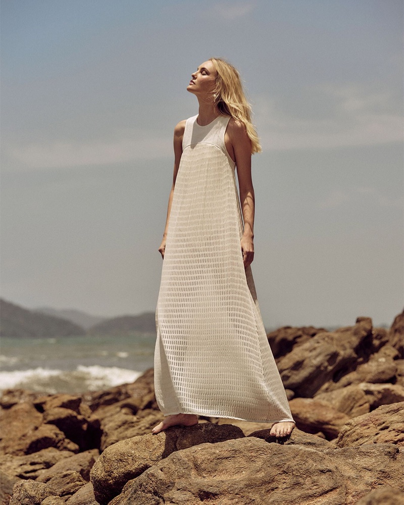 Posing in a white dress, Caroline Trentini fronts Animale summer 2022 campaign.