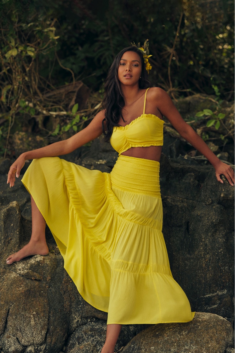 Lais Ribeiro wears yellow top and skirt set in Animale summer 2022 campaign.