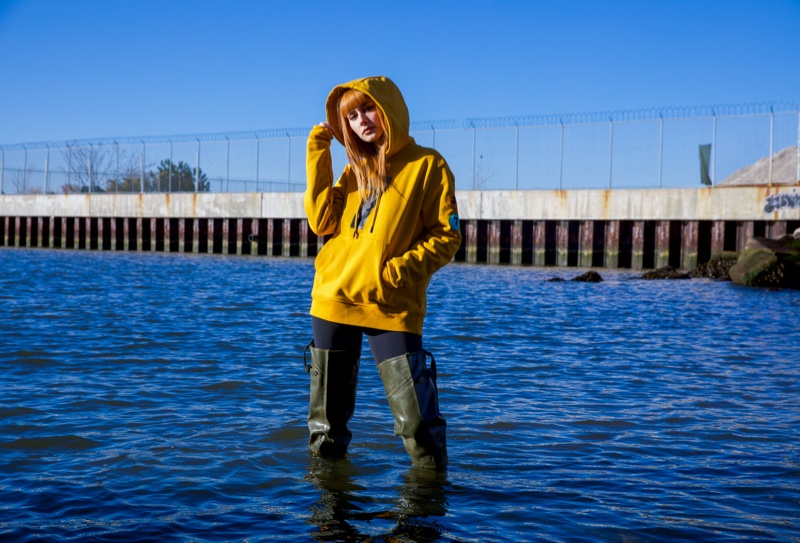 Musician Annalise Azadian poses in the Save the Duck x Compound collaboration.