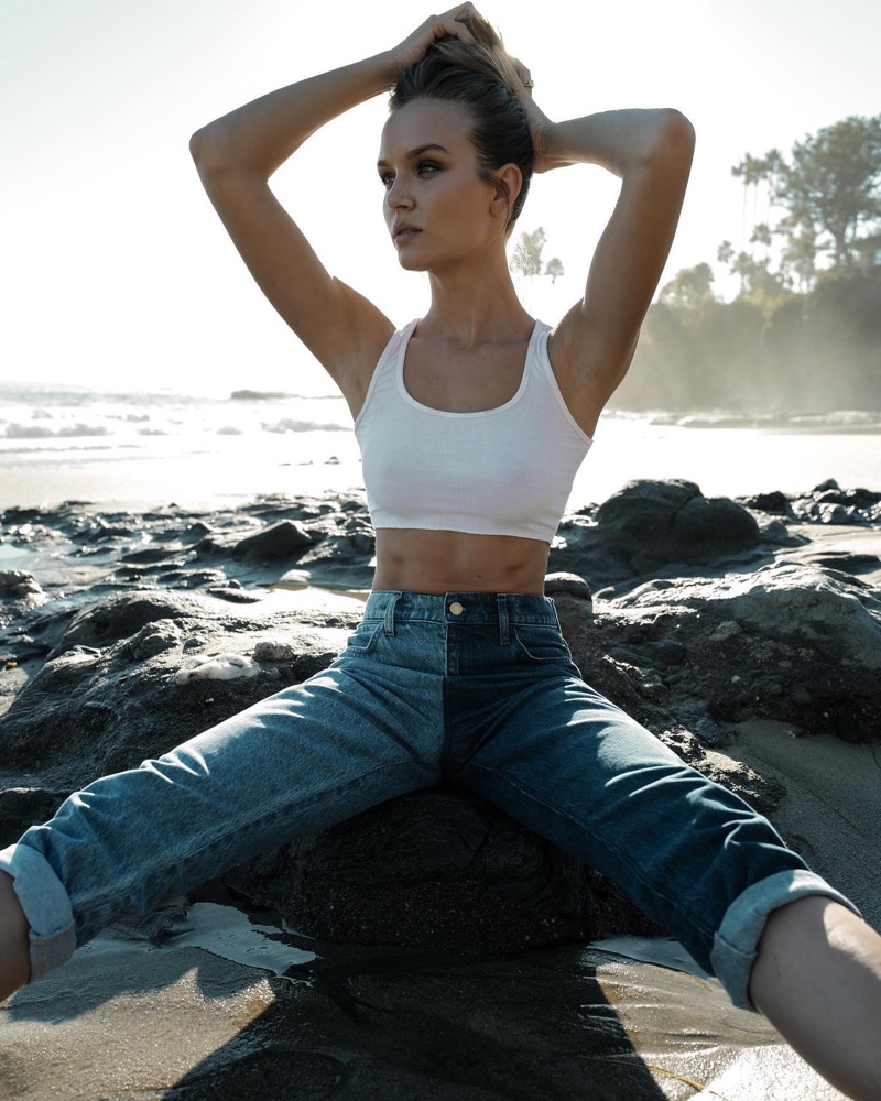 Josephine Skriver poses in a two tone jean from her Triarchy collaboration.