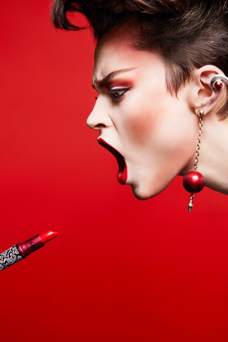 Model Isabella Emmack wears MAC Cosmetics Viva Glam x Keith Haring Red Haring lipstick.
