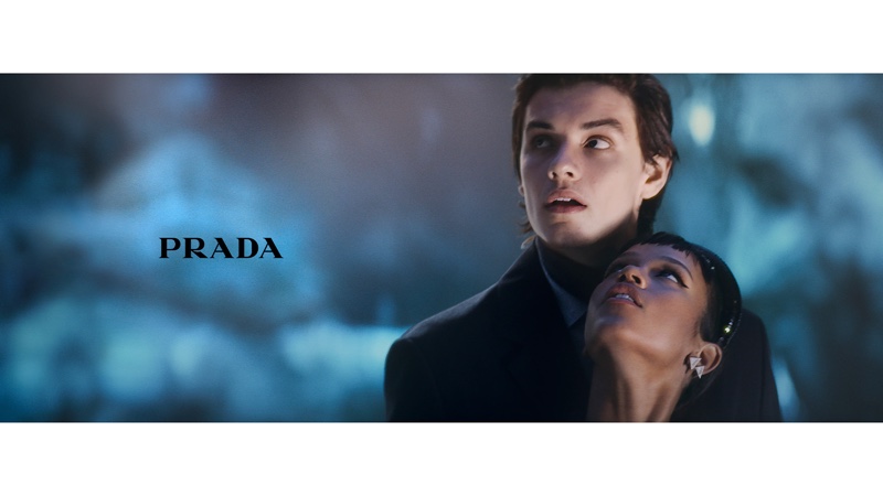 Louis Partridge and Taylor Russell look up in Prada Holiday 2021 campaign. Photo: Glen Luchford