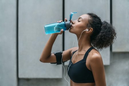 Woman Drinking Blue Water Bottle Activewear