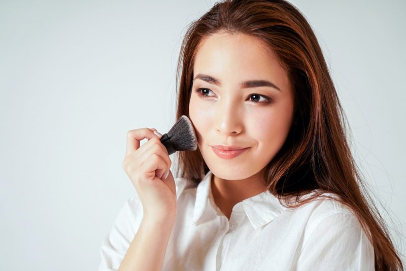 Woman Putting on Makeup