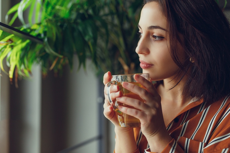 Attractive Woman Holding Green Tea Cup