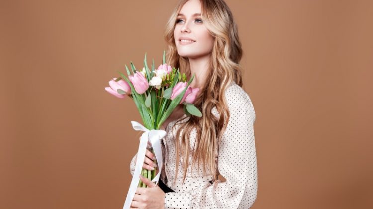 Blonde Woman Holding Flowers Happy