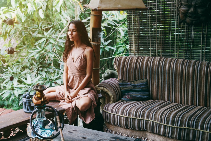 Brunette Woman Outside Couch Garden Greenery