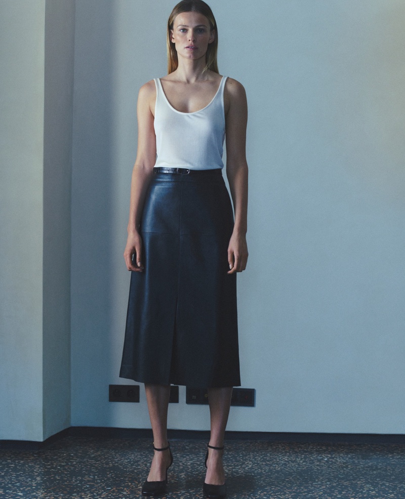 Edita Vilkeviciute models Massimo Dutti ribbed vest top, long nappa leather skirt, and high-heel shoes with ankle strap.
