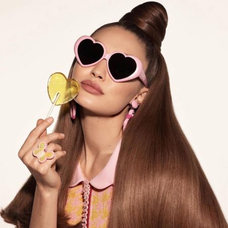 See More of Moschino's Spring 2022 Campaign With Gigi, Imaan, Abby Gigi Hadid Moschino Pink Heart-Shaped Sunglasses Lollipop