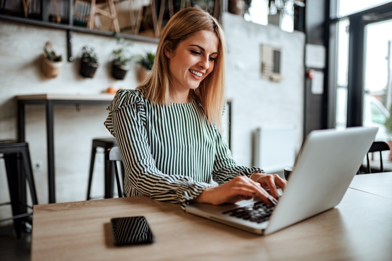 Happy Woman Working Laptop Striped Blouse