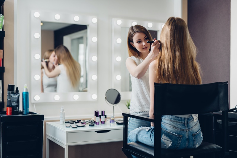 Mirrors Makeup Artist Working Client