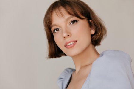 Bangs, Hair Products, and More: What Causes Forehead Acne and How to Deal With It Model Bob Hairstyle Bangs Beauty