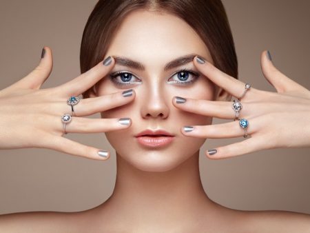 The Latest Trends in Nail Art Model Silver Metallic Manicure Rings Beauty