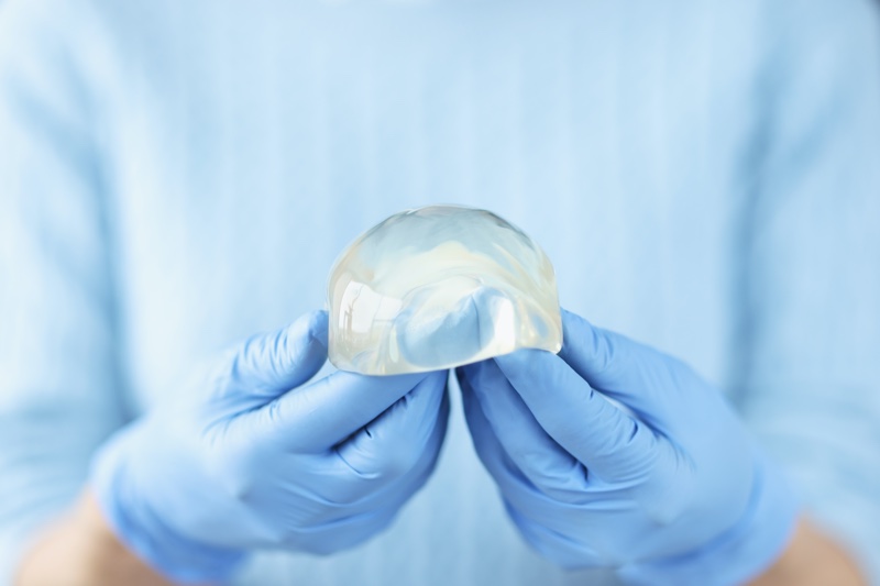 Surgeon Holding Silicone Breast Implant