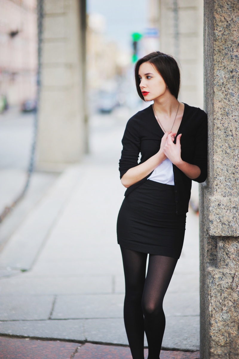 Woman Black Cardigan Sweater Mini Skirt Stockings Outfit