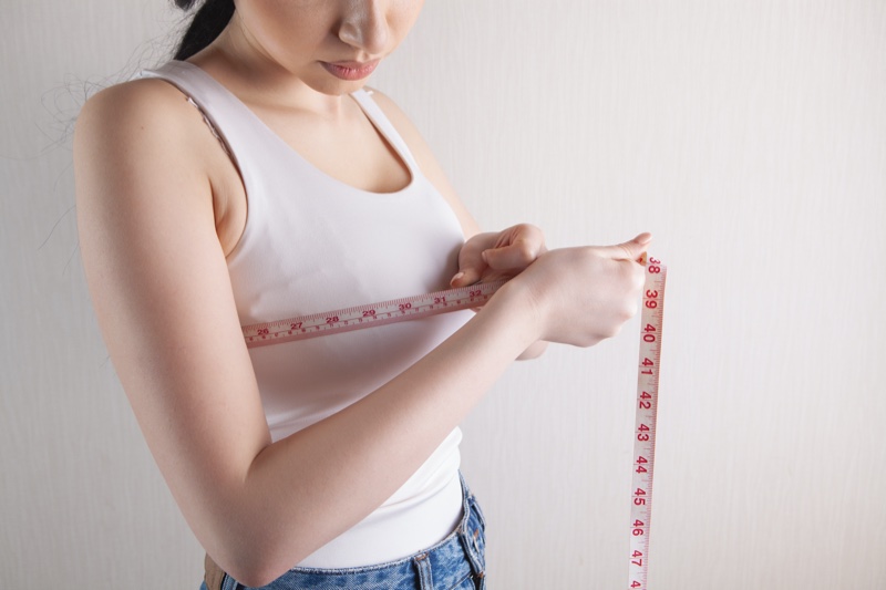 Woman Measuring Bustline Tape