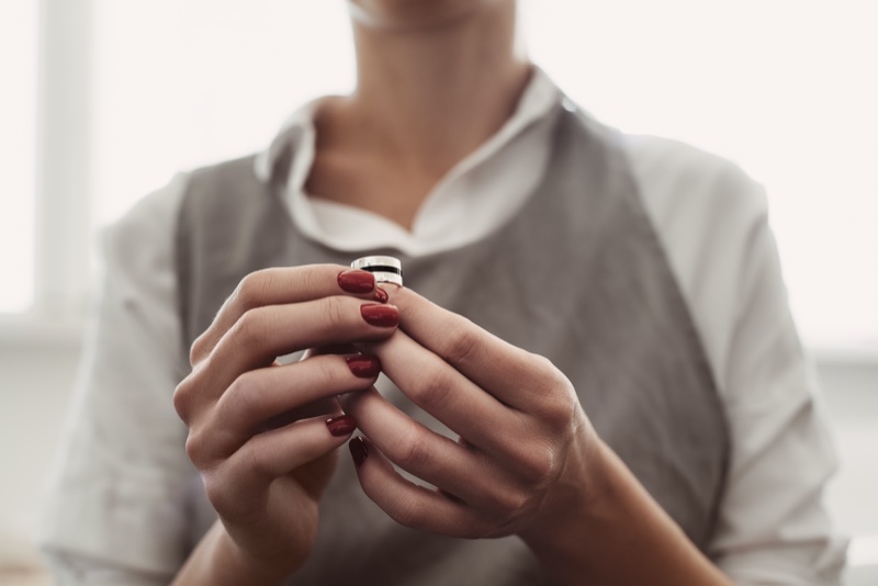 Woman Red Nails Holding Ring