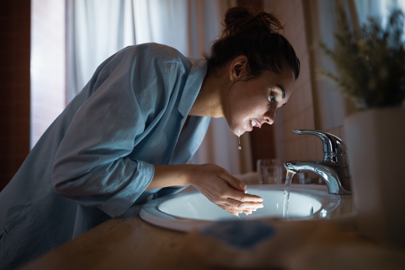 Attractive Woman Washing Face Night