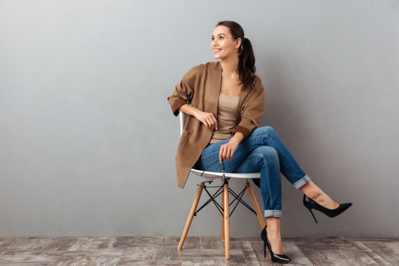 Happy Woman Sitting Jeans Brown Jacket