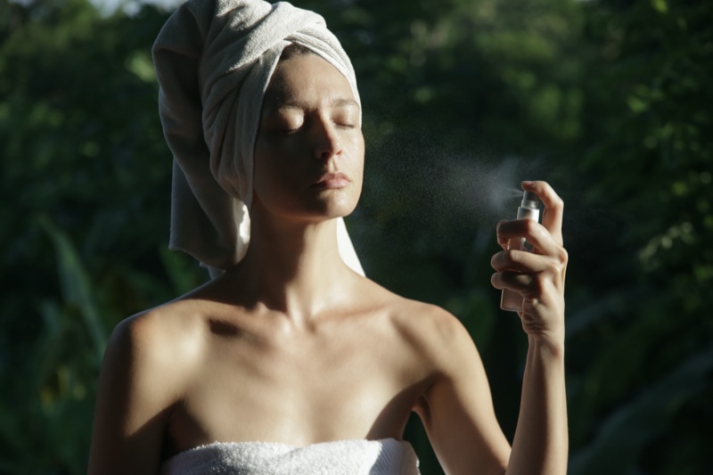 Outside Woman Applying Spray Mist Skincare