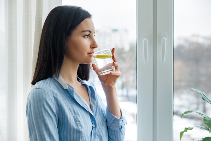 Woman Drinking Lemon Water Glass