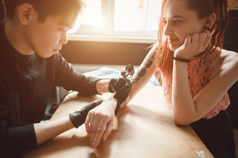 Woman Getting Tattoo