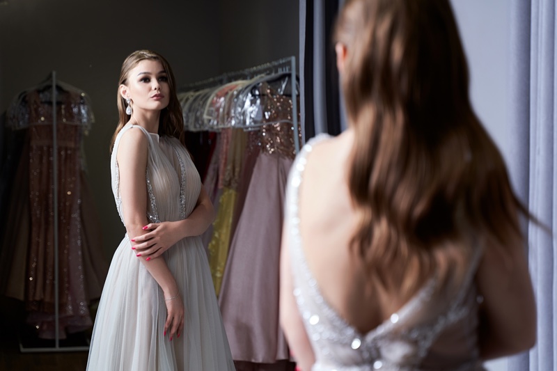 Woman Trying Elegant Dress Mirror Glitter Detail