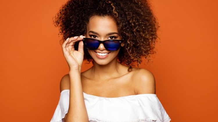 Smiling Model Blue Lens Sunglasses Off Shoulder Top