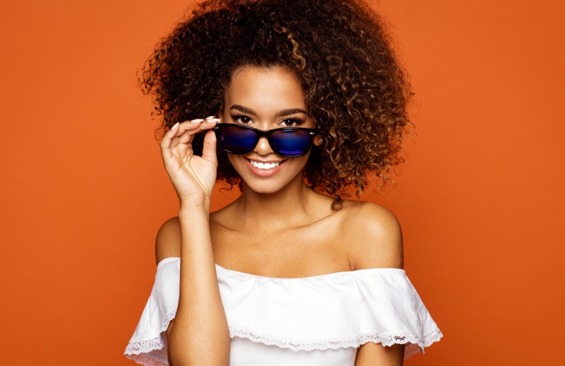 Smiling Model Blue Lens Sunglasses Off Shoulder Top