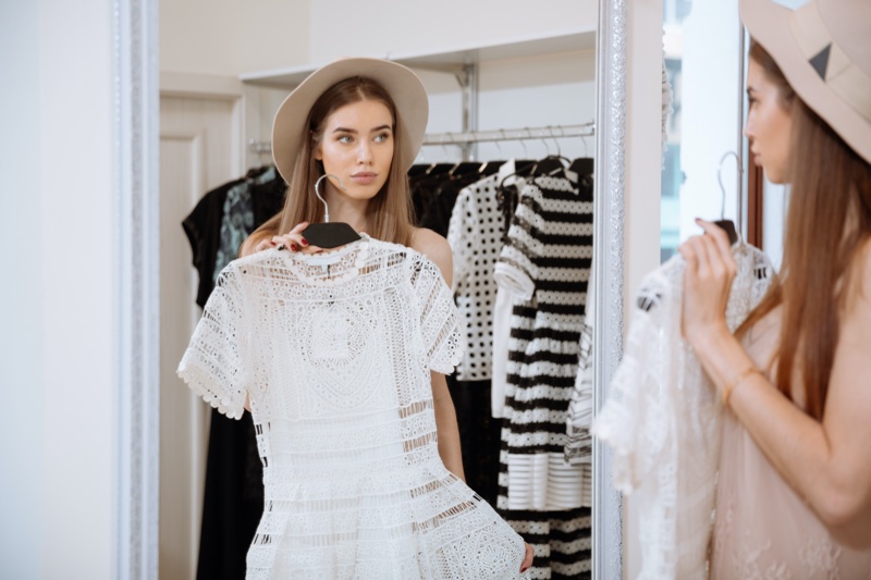 Fashion Model Mirror Holding White Lace Dress
