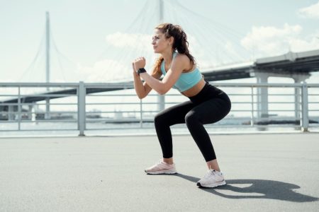 Living: What Are The Benefits of a Healthy Fitness Routine? Fitness Woman Squatting