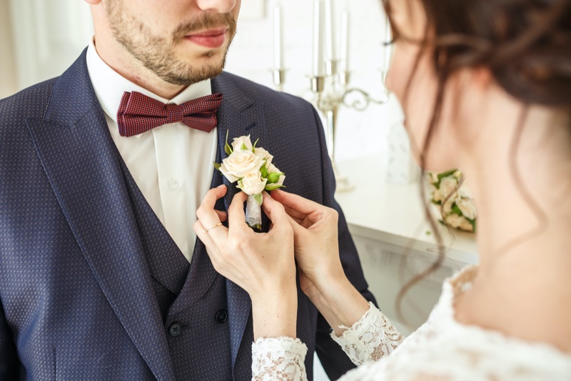 Groom Boutonniere Placed Bride