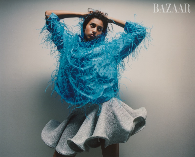 Imaan Hammam models embellished Valentino top with JW Anderson ruffled skirt.