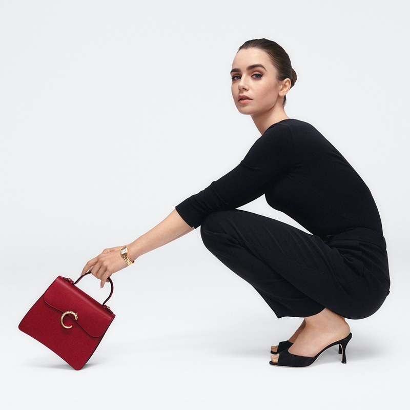 Lily Collins models with Panthère de Cartier bag.