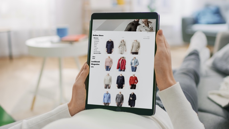 Woman Browsing Clothing Store Website Tablet