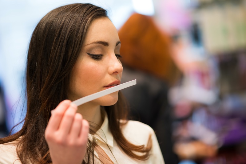 Woman Smelling Fragrances