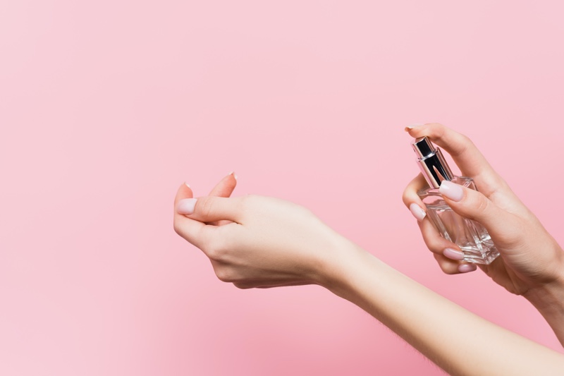 Woman Spraying Fragrance