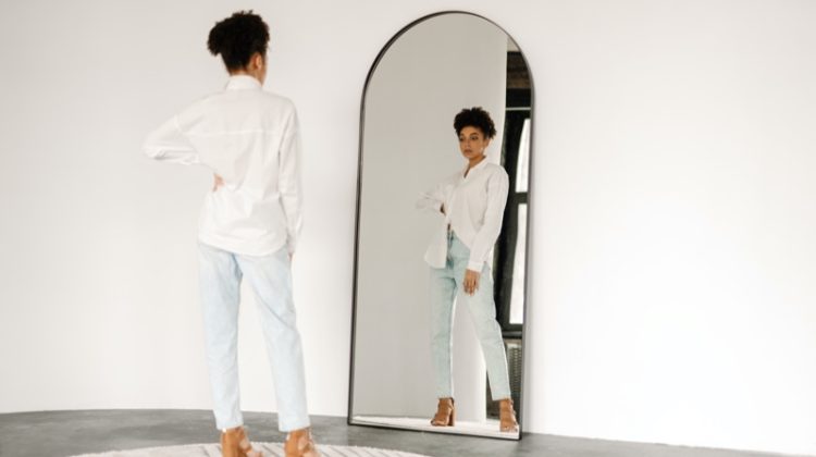 Woman Trying on Jeans Mirror