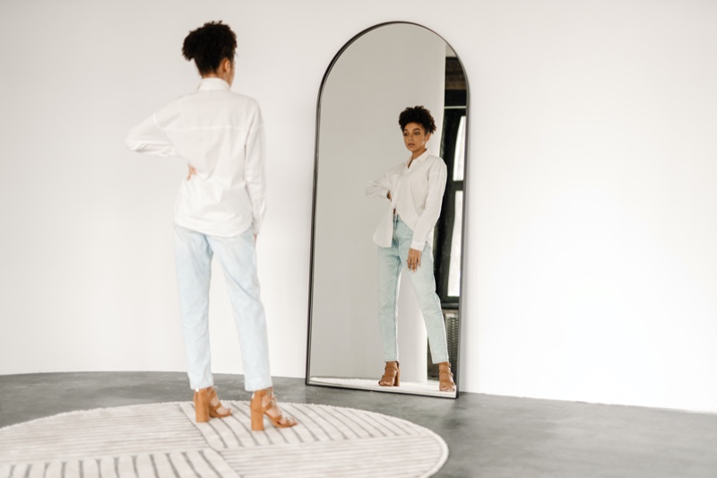 Woman Trying on Jeans Mirror