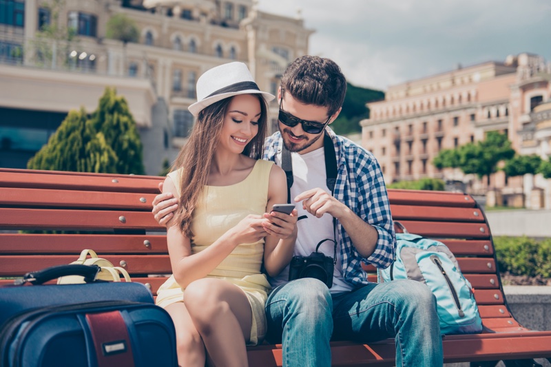 Young Couple Luggage Sitting Bench