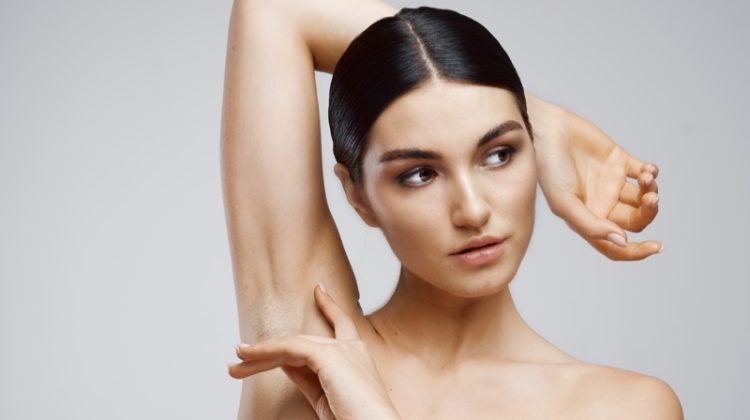 Beauty Model Showing Smooth Armpit Hair Removal Concept