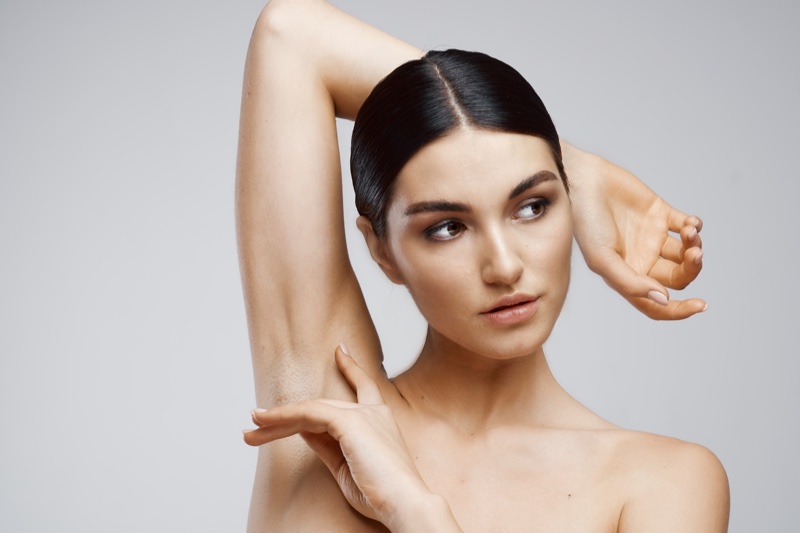 Beauty Model Showing Smooth Armpit Hair Removal Concept