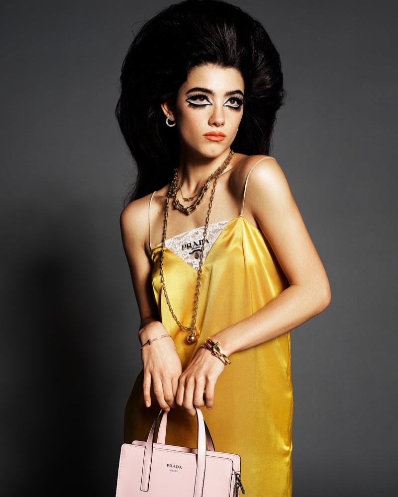 Charli D’Amelio models yellow Prada dress and bag with Tiffany & Co. jewelry.