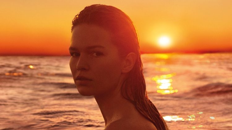 Anna Ewers Takes a Dip in Jil Sander ‘Sunset’ Perfume Campaign