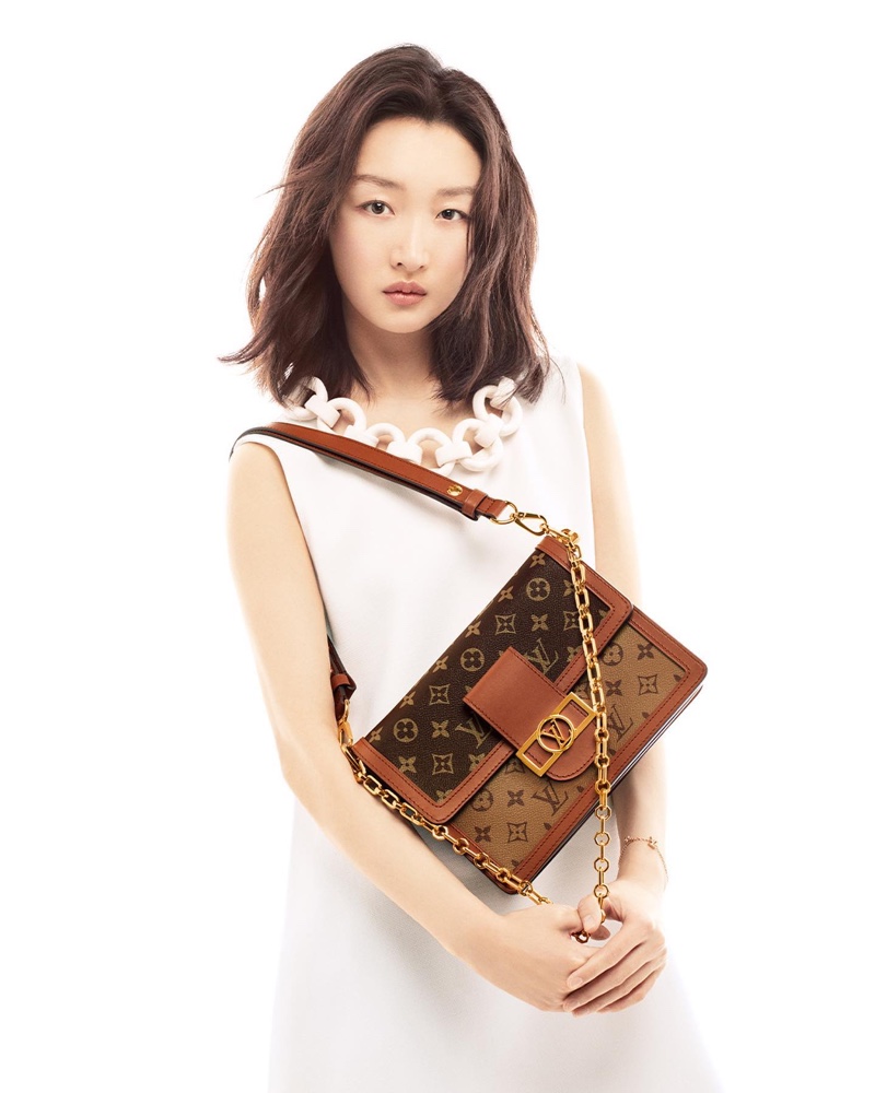 Zhou Dongyu poses for Louis Vuitton Dauphine bag spring-summer 2022 campaign.