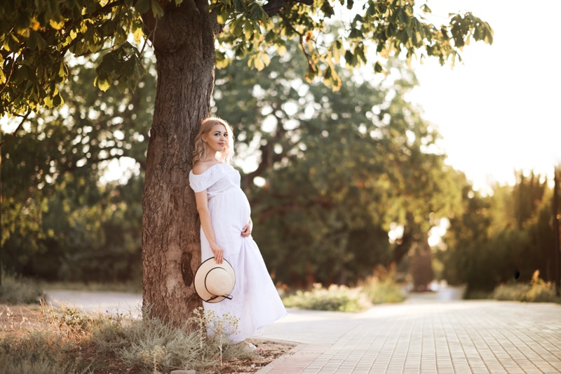 Maternity Style Woman White Dress Outdoors Tree